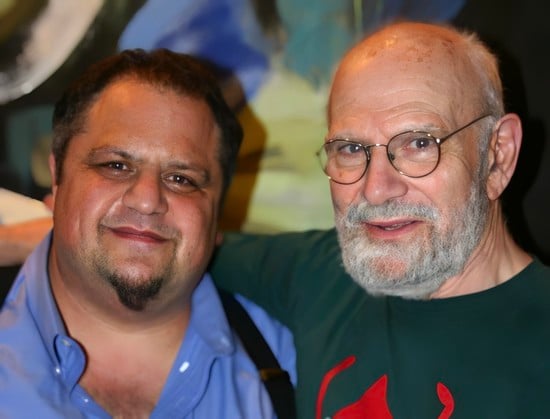 Steve Silberman on the left in a blue shirt with a black goatee and Oliver Sacks on the right with glasses and a trimmed white beard.