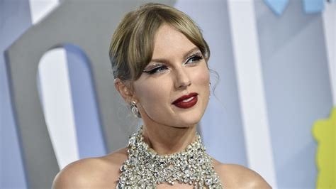 Taylor Swift in a high neck line crystal dress